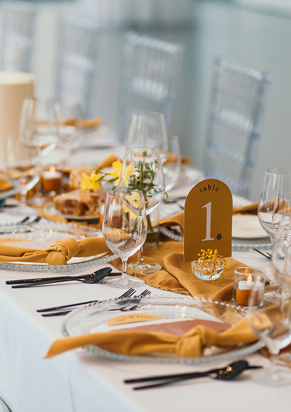 White table linen with honey coloured accents